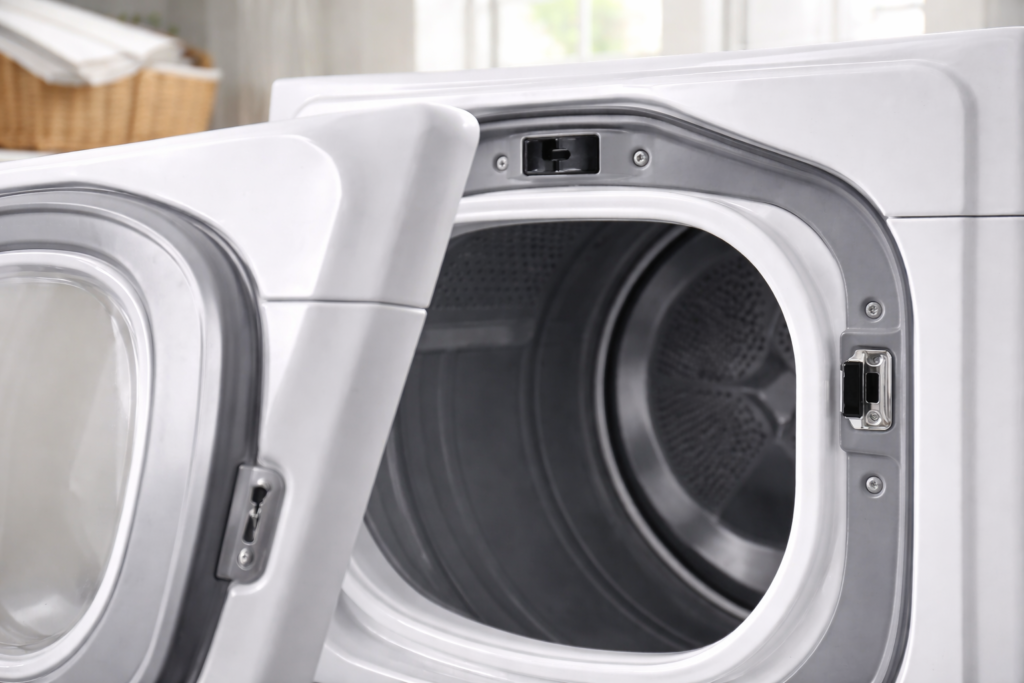 Dryer door slightly open showing the door switch location inside the frame