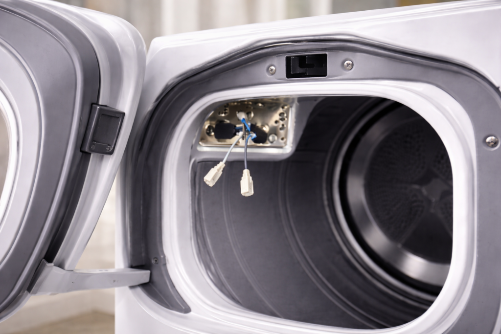 Dryer door switch mounting location inside the dryer frame ready for replacement